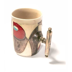 Side View of option "AD". Notice the antiqued brass handle and the design; flowing with a matching copper-brass color, featuring light a single blue symbol on each. this mug is imprinted with an "8".